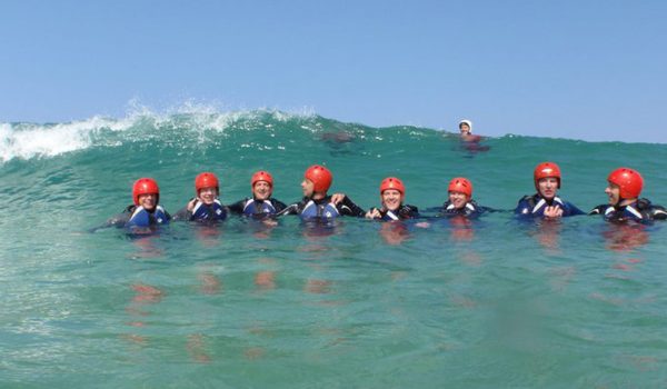 Group of people in the sea coasteering