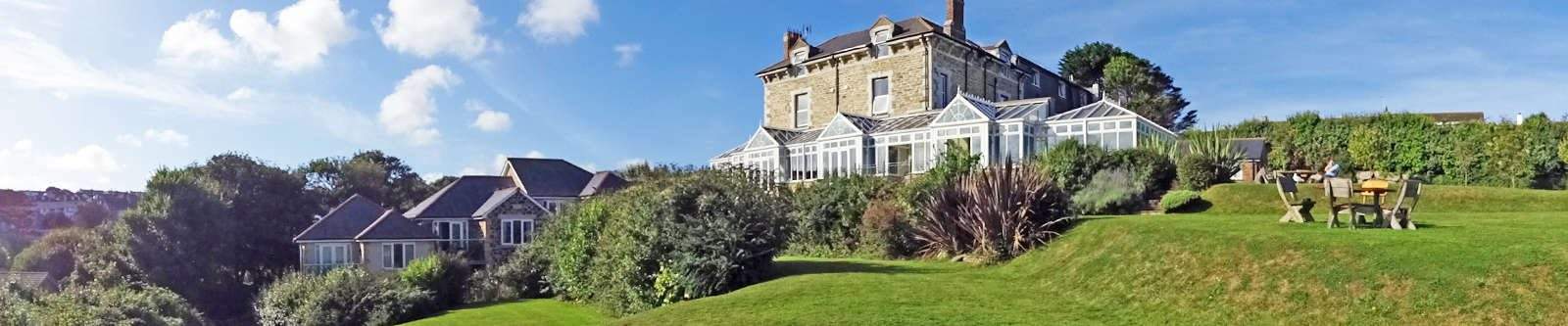 Narrow image of Porth Veor Manor and gardens with villas