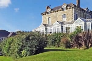 Narrow image of Porth Veor Manor and gardens with villas