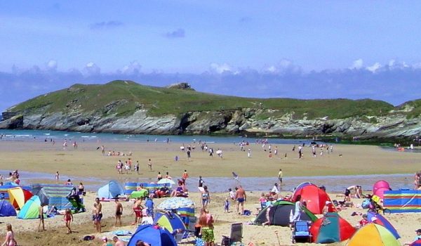 Crowds of people enjoying Porth beach