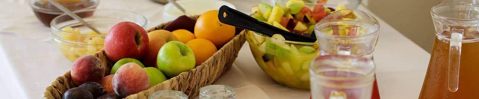 breakfast options of fresh fruit, juice and yoghurt