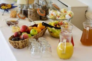 breakfast options of fresh fruit, juice and yoghurt