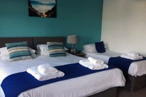 double and single bed in triple beach view room