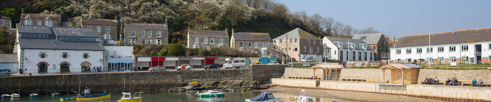 Porthleven Harbour with boats in the water