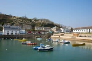 Porthleven Harbour with boats in the water