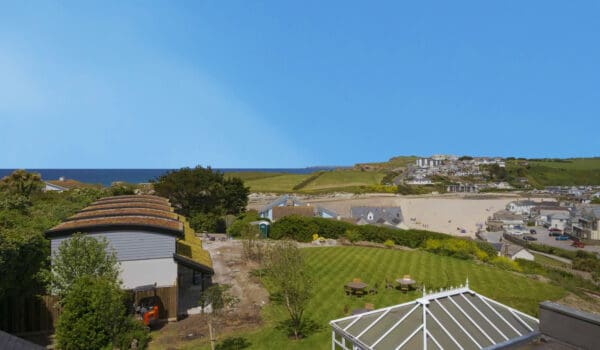 View of Porth Beach and Porth Veor Manor Hotel's gardens